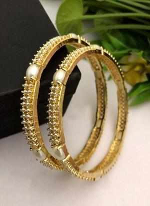 Gold Bangles with Pearl Highlights